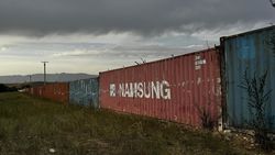 В Кеминском районе убрали железный забор из контейнеров. Фото