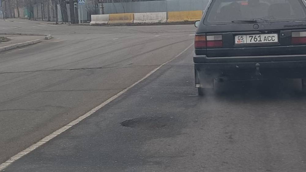 Дорога на мосту по ул.Фрунзе весь в ямах. Фото
