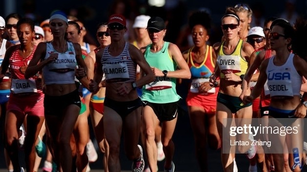 Дарья Маслова (жашыл кийимчен)